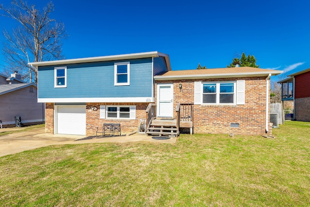 split level home with brick siding, concrete driveway, crawl space, a garage, and a front lawn