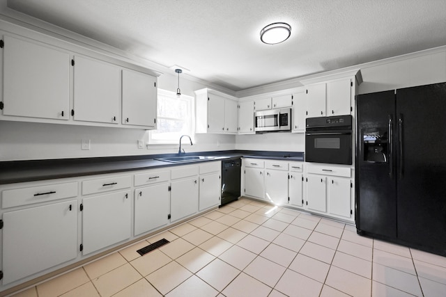 kitchen with visible vents, white cabinets, dark countertops, black appliances, and a sink