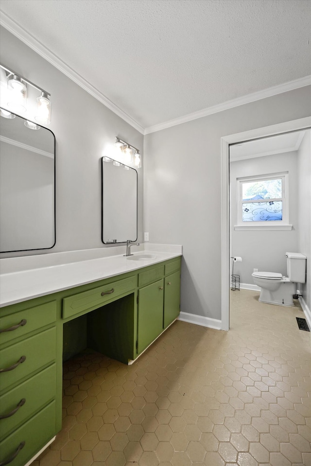 full bath featuring a textured ceiling, toilet, vanity, visible vents, and ornamental molding