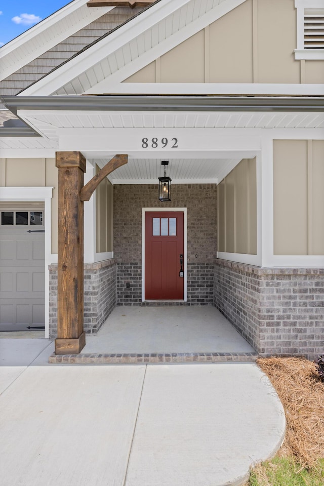 8892 Knolling Loop Unit 34, Ooltewah, TN 37363 - view of exterior entry with brick siding and covered porch