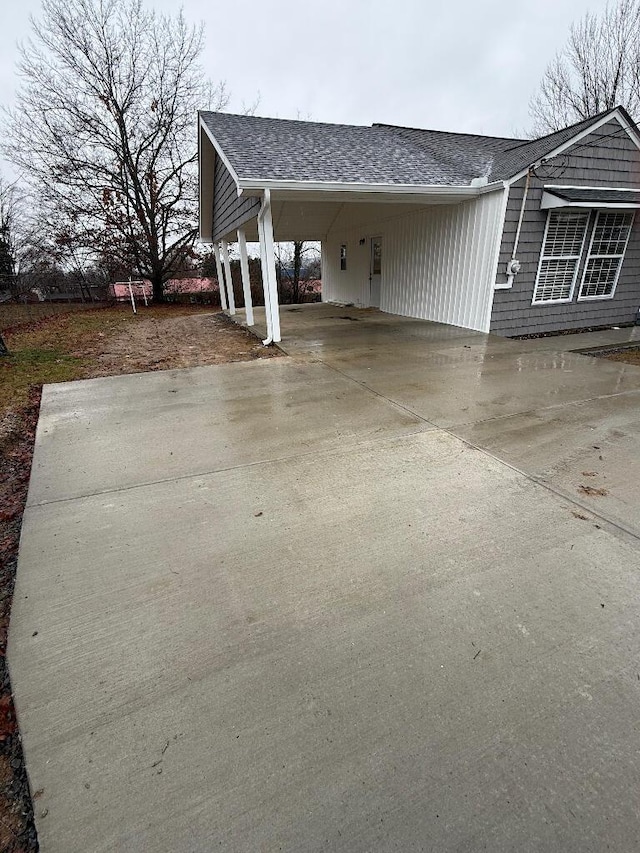 view of front of property featuring a carport