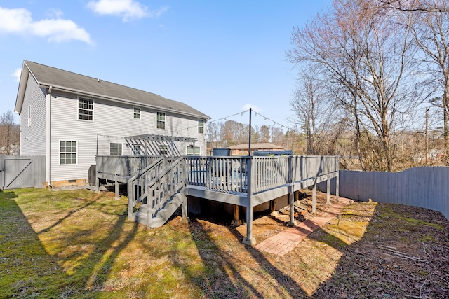 rear view of house featuring a deck and a pergola