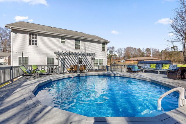 view of swimming pool with a deck, a pergola, and a hot tub