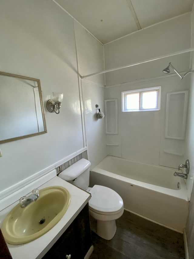 full bathroom featuring vanity, hardwood / wood-style floors, toilet, and shower / bath combination