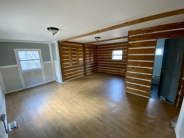 empty room with hardwood / wood-style flooring