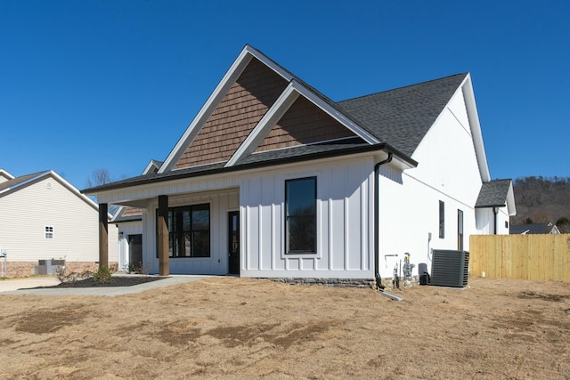 back of house featuring central air condition unit