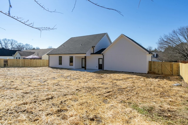 back of property with a patio