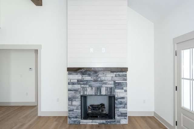 unfurnished living room with a fireplace and light hardwood / wood-style flooring