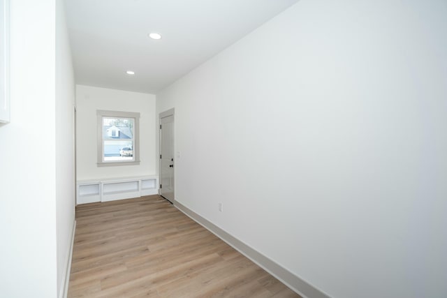 hall with light hardwood / wood-style floors