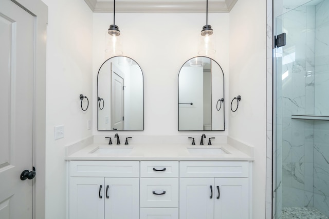 bathroom with crown molding, vanity, and a shower with shower door