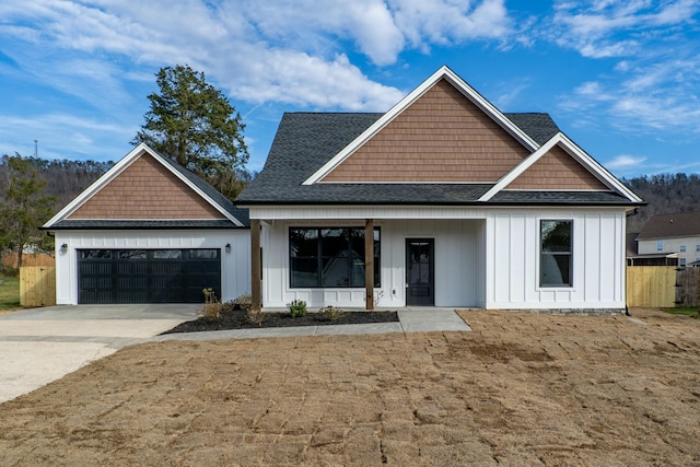 view of front of property featuring a garage and a porch