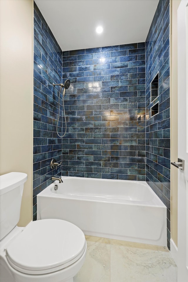 bathroom featuring toilet and shower / bathtub combination