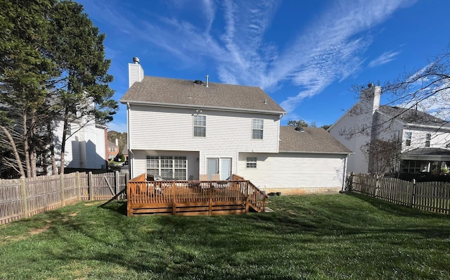 back of property featuring a wooden deck and a lawn