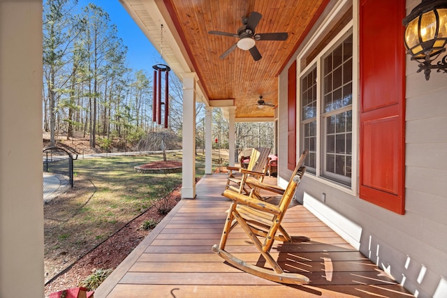 deck featuring ceiling fan and a porch