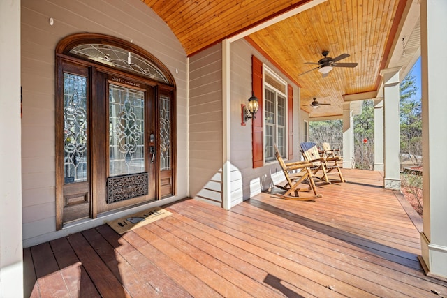 deck featuring covered porch and ceiling fan