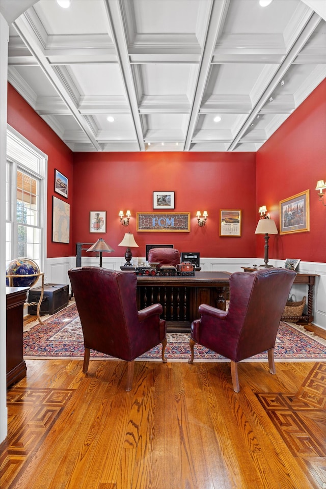 interior space featuring coffered ceiling, wood finished floors, and beam ceiling