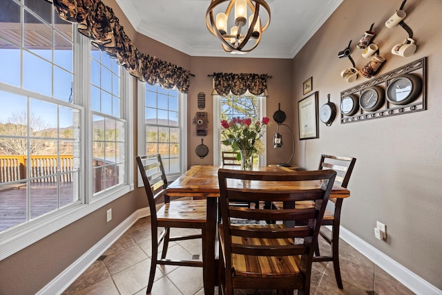 tiled dining space with ornamental molding, an inviting chandelier, and baseboards