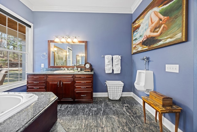 full bathroom featuring plenty of natural light, baseboards, crown molding, and vanity