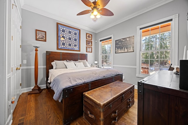 bedroom with visible vents, wood finished floors, and ornamental molding