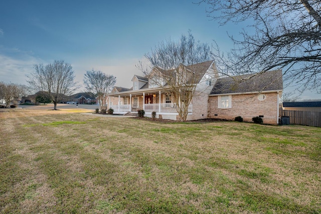 view of front of house featuring a porch, central AC, and a front yard