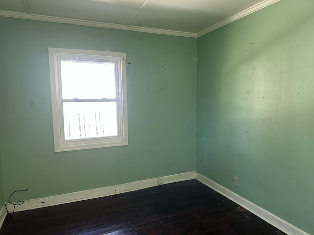 unfurnished room with crown molding and dark hardwood / wood-style floors