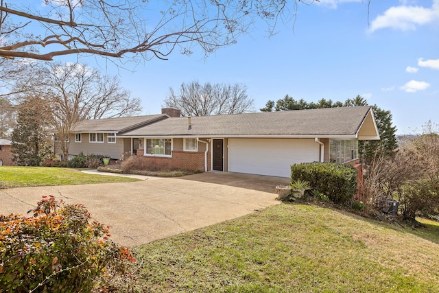 single story home with a garage, brick siding, concrete driveway, a front lawn, and a chimney