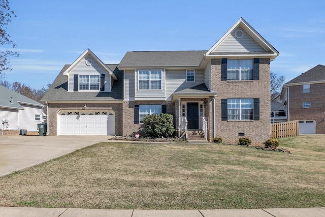 view of front of property featuring a garage and a front yard