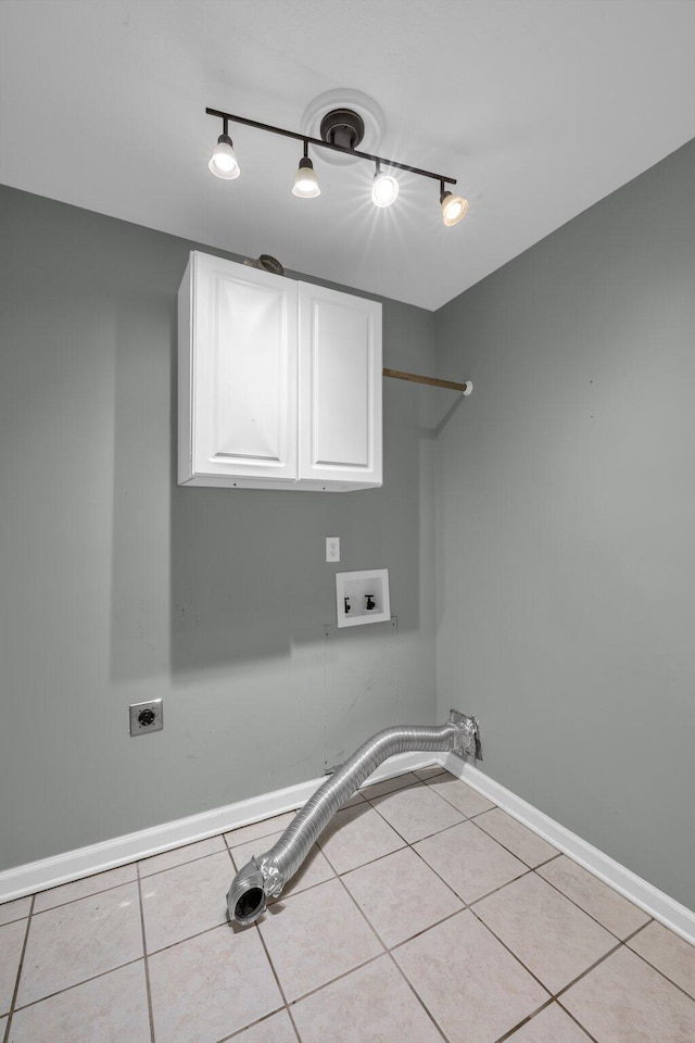 laundry area featuring electric dryer hookup, cabinets, washer hookup, track lighting, and light tile patterned flooring