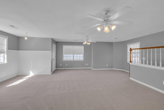 carpeted empty room featuring a healthy amount of sunlight