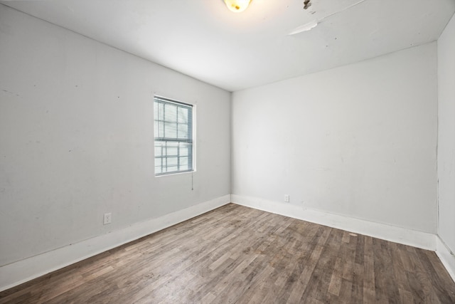 empty room featuring wood-type flooring