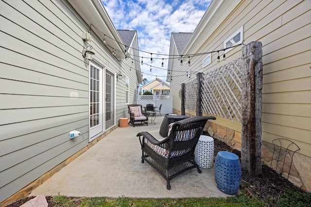 view of patio featuring fence