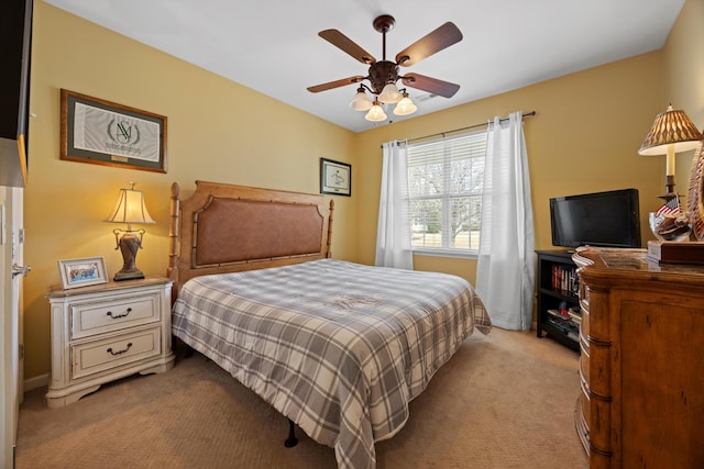 bedroom featuring light carpet and ceiling fan