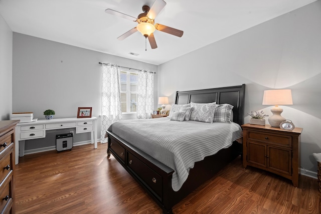 bedroom featuring a ceiling fan, baseboards, visible vents, and dark wood-type flooring