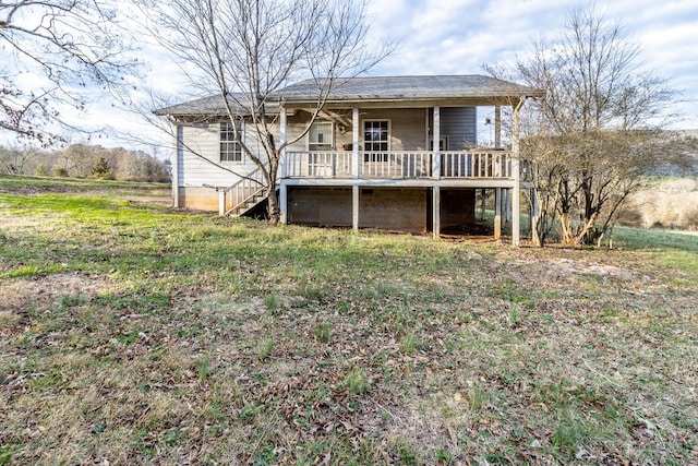 view of front facade with a front lawn and stairway