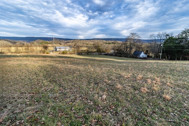 view of mountain feature with a rural view