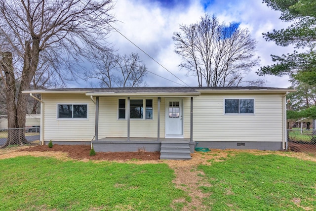 view of front of home with a front yard and covered porch