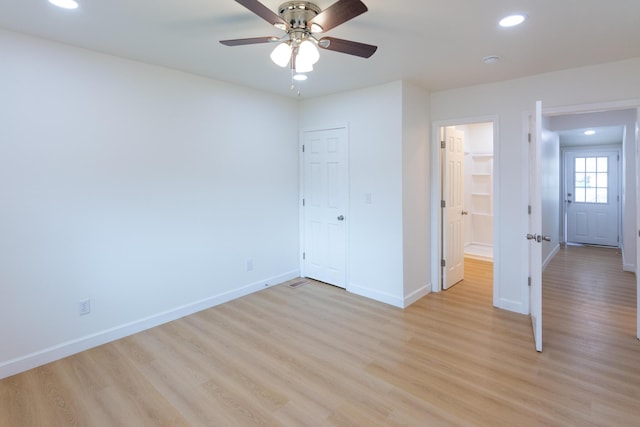 unfurnished bedroom featuring light hardwood / wood-style floors and ceiling fan