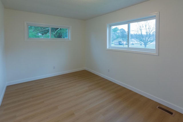 empty room with light hardwood / wood-style floors