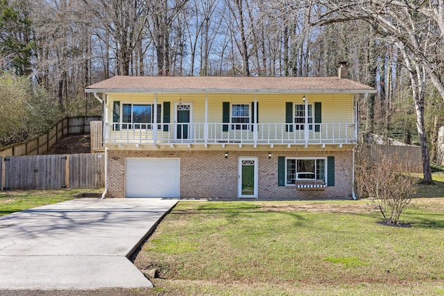 view of front of home featuring a garage and a front lawn