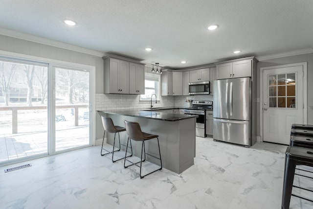 kitchen featuring visible vents, marble finish floor, gray cabinetry, appliances with stainless steel finishes, and a peninsula