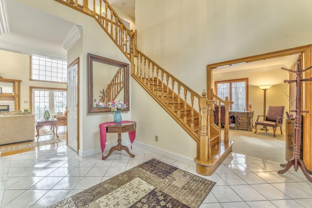815 Battlefield Park Dr, Dalton, GA 30720 - staircase featuring tile patterned flooring, a towering ceiling, ornamental molding, and french doors