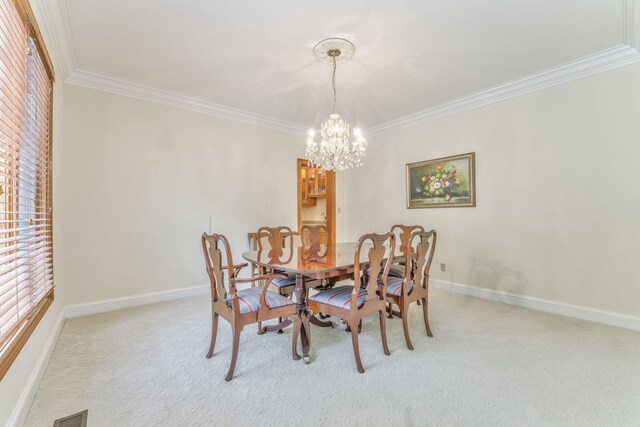 815 Battlefield Park Dr, Dalton, GA 30720 - dining room featuring an inviting chandelier, crown molding, and carpet floors
