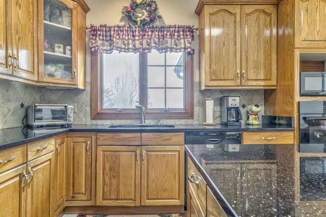 815 Battlefield Park Dr, Dalton, GA 30720 - kitchen with dark stone counters, sink, decorative backsplash, and black appliances