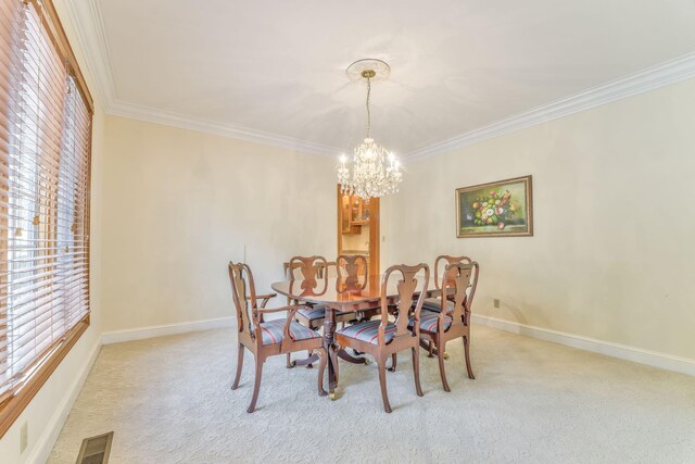 815 Battlefield Park Dr, Dalton, GA 30720 - carpeted dining area featuring ornamental molding and a chandelier
