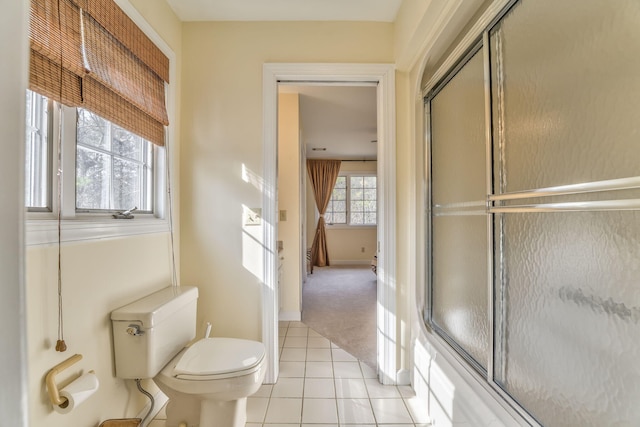815 Battlefield Park Dr, Dalton, GA 30720 - bathroom with combined bath / shower with glass door, tile patterned floors, and toilet