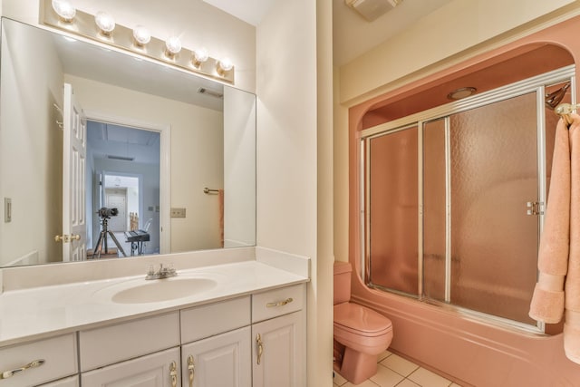 815 Battlefield Park Dr, Dalton, GA 30720 - full bathroom featuring bath / shower combo with glass door, vanity, tile patterned floors, and toilet