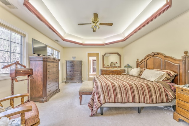 815 Battlefield Park Dr, Dalton, GA 30720 - carpeted bedroom with connected bathroom, a raised ceiling, and ceiling fan