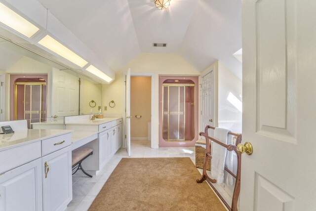 815 Battlefield Park Dr, Dalton, GA 30720 - bathroom featuring tile patterned floors, lofted ceiling, a shower with shower door, and vanity