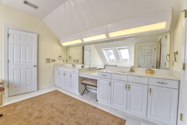 815 Battlefield Park Dr, Dalton, GA 30720 - bathroom featuring lofted ceiling with skylight, tile patterned floors, and vanity
