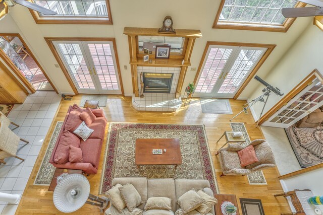 815 Battlefield Park Dr, Dalton, GA 30720 - living room with a high ceiling, a healthy amount of sunlight, a fireplace, and french doors